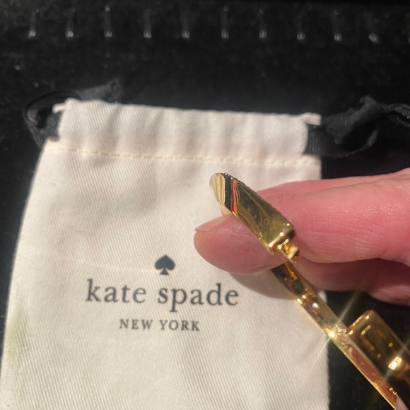 KATE SPADE gold bracelet with diamond detail on curve of band. Opens with clasp - Picture 3 of 4